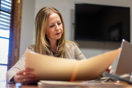 Facility manager reviewing a comprehensive indoor air quality report to ensure a safe environment for building occupants.